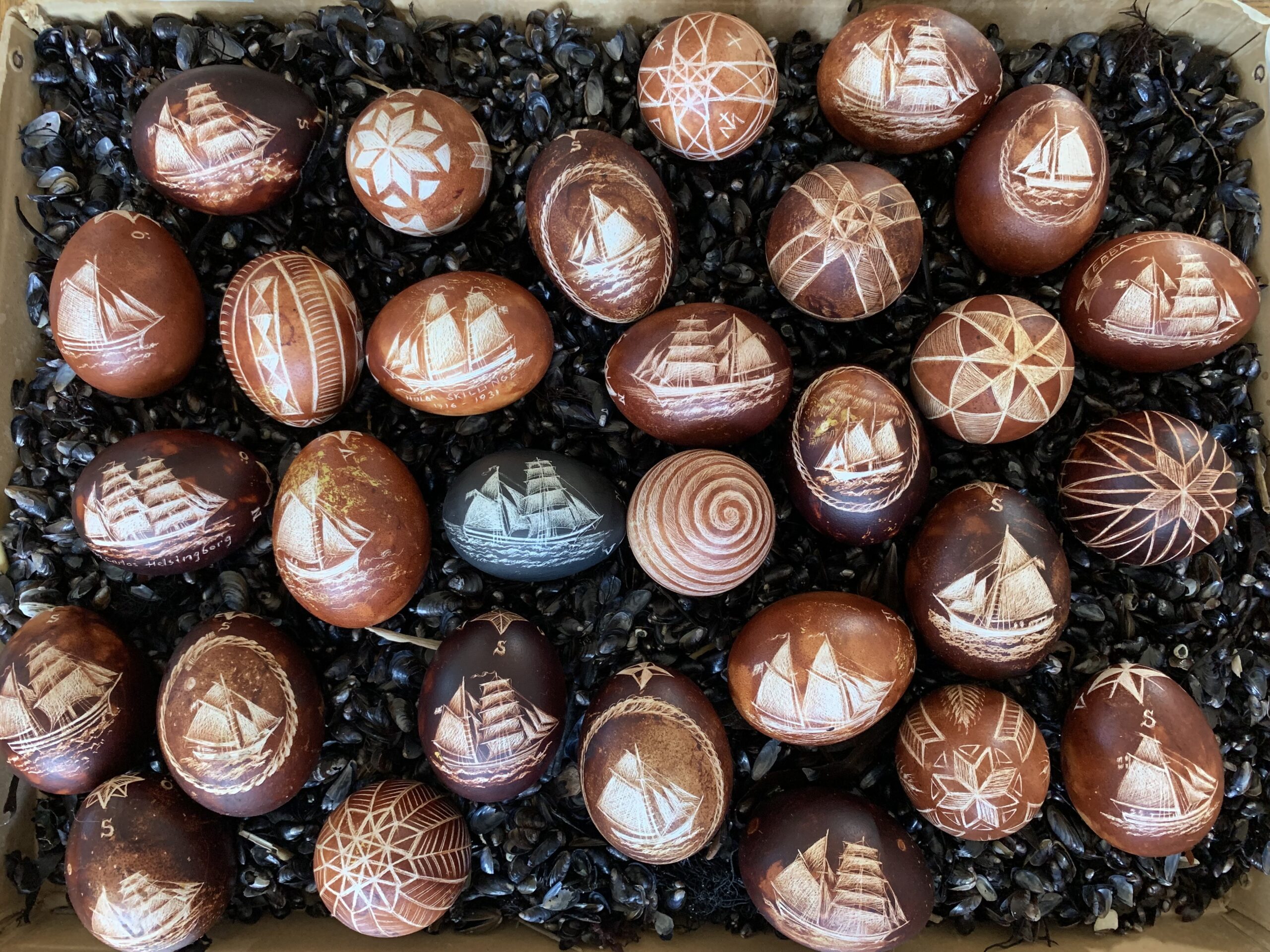 Carved eggs with ship motifs by Maria Lancing